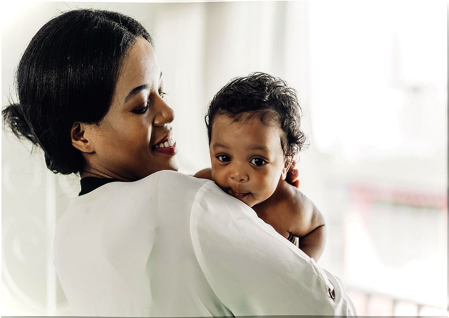 Mom with her baby in her arms.