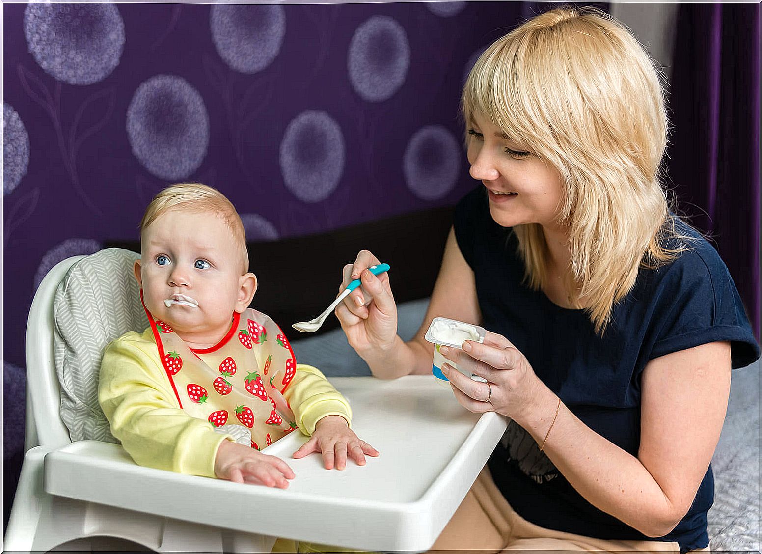 Baby eating yogurt to strengthen the immune system.