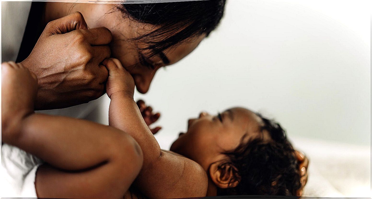 Mom playing with her baby for his development.