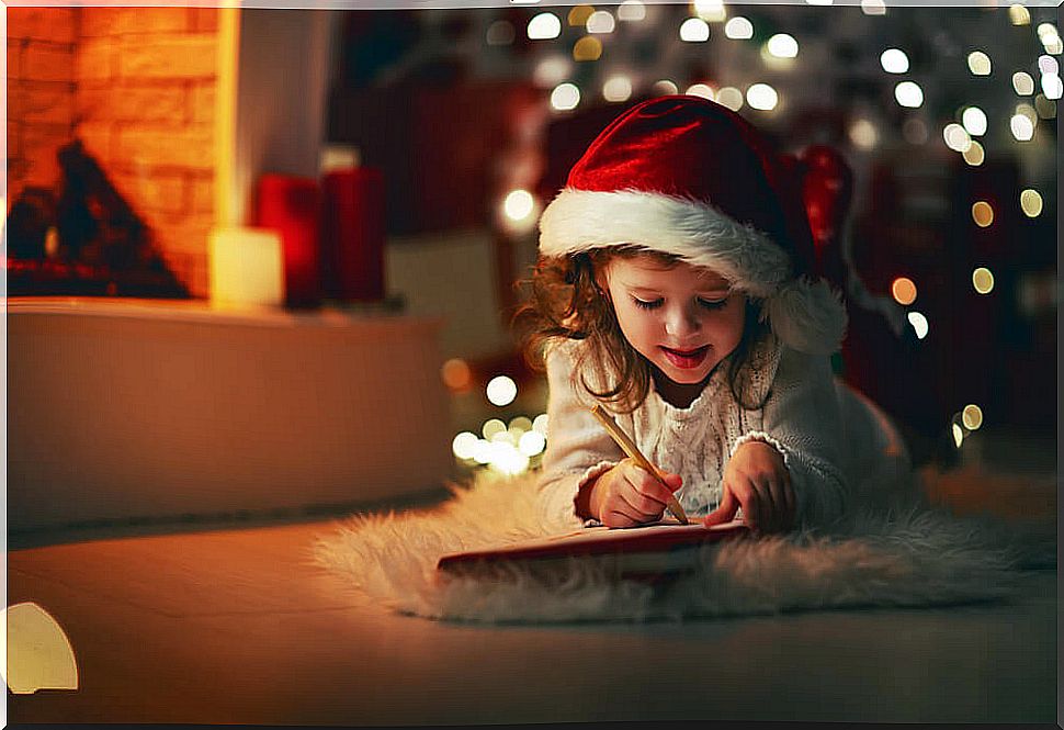 Girl writing the letter to Santa Claus and the Three Wise Men after having seen the short A shorter letter with her parents.