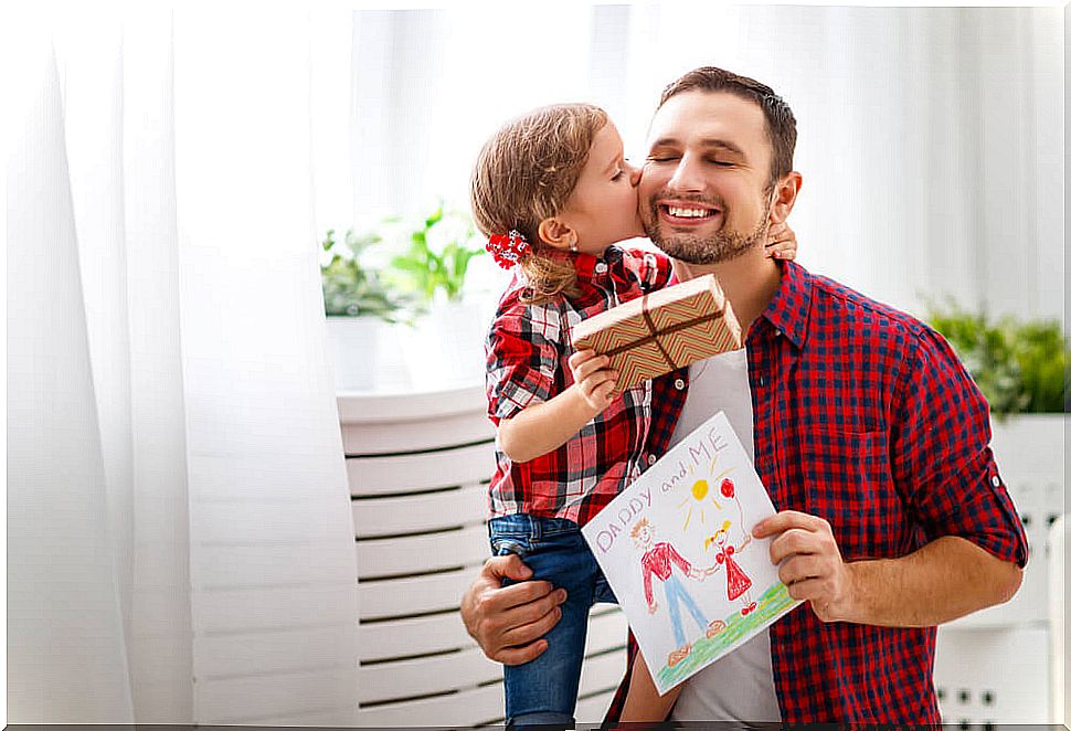 Daughter giving her father a gift for Father's Day.