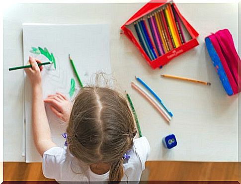 A girl coloring is developing her fine motor skills.