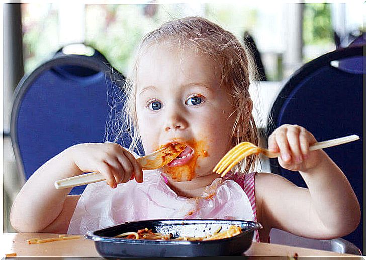 girl eating in a restaurant