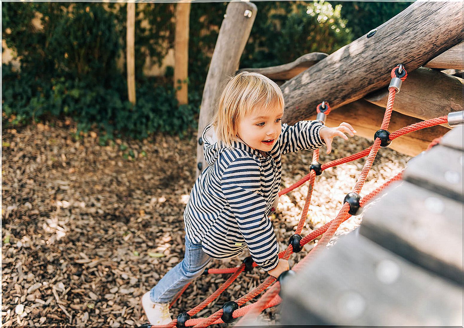 Girl playing in the park as part of unstructured play.