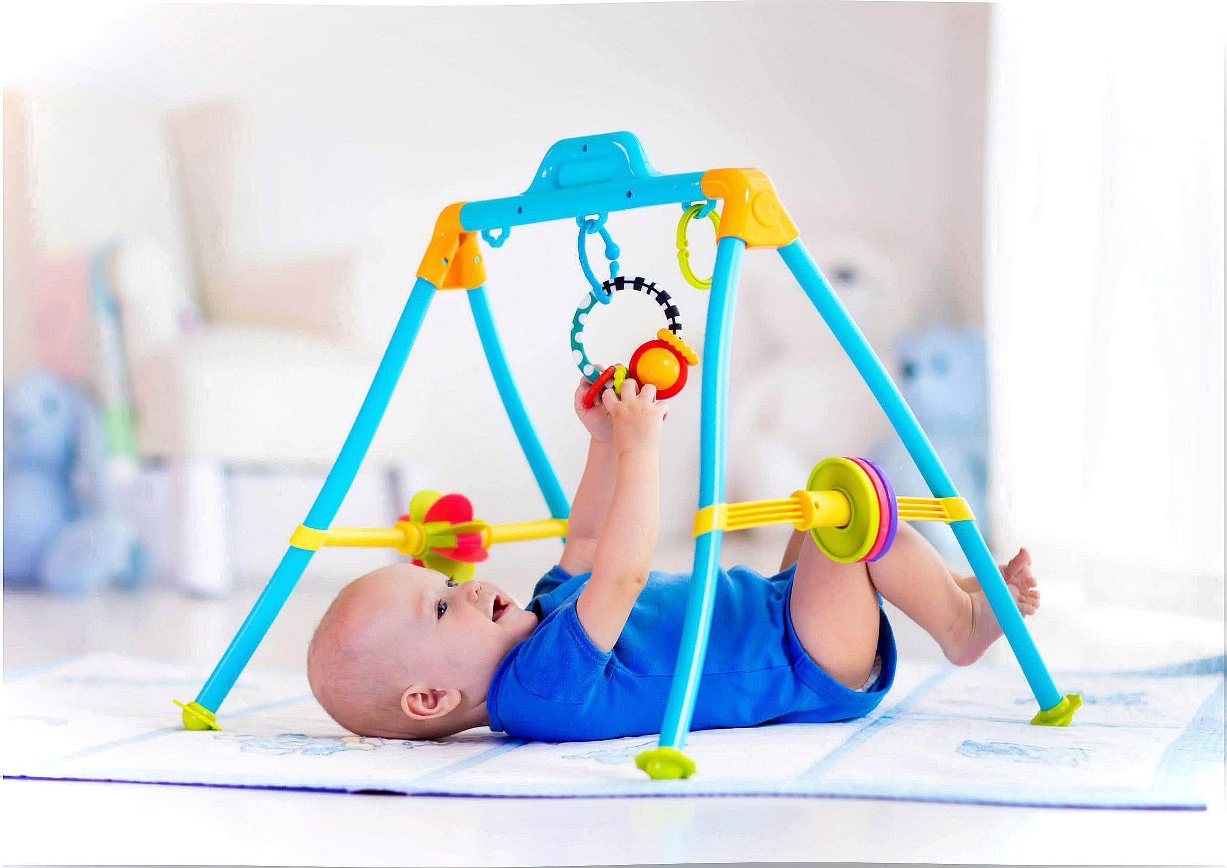 Baby exercising in her early stimulation gym.