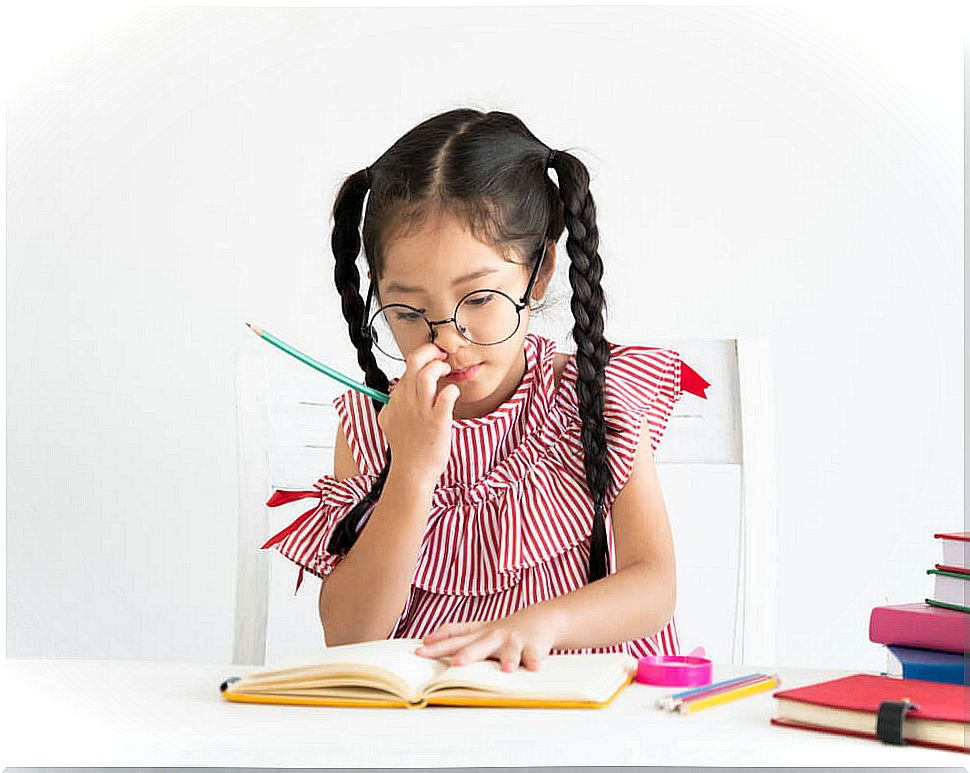 Girl studying in her room and making diagrams.