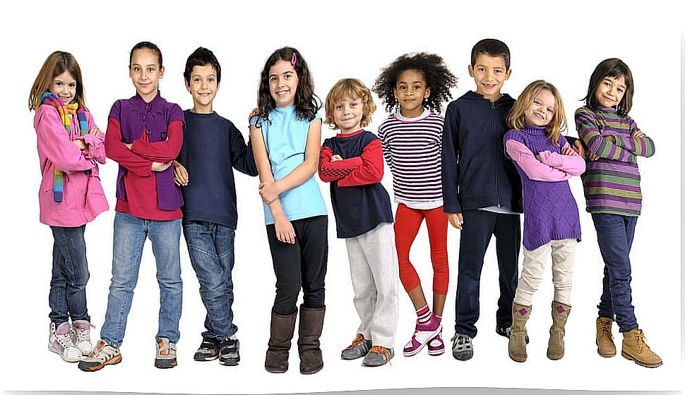 Children posing for a photo after learning non-cognitive skills.