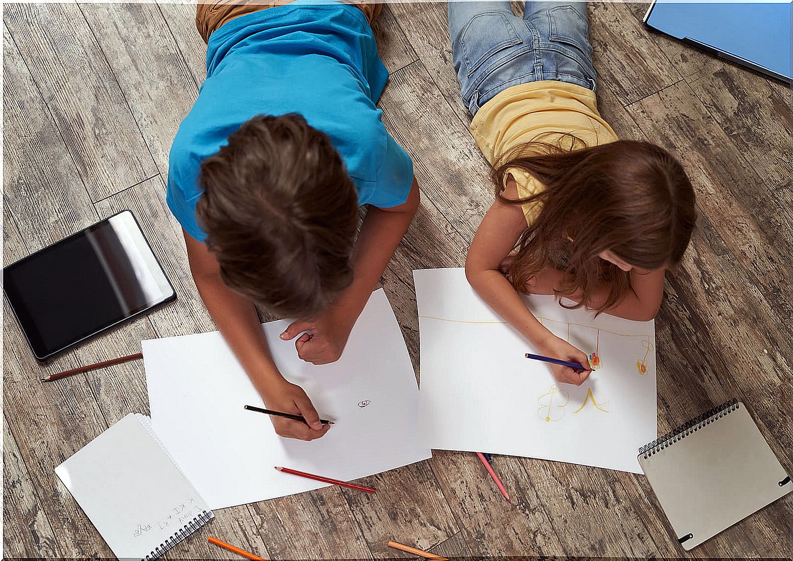 Children drawing and doing the house test.