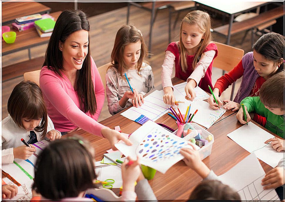 Teacher with her students instilling in her students the importance of emotions in learning.