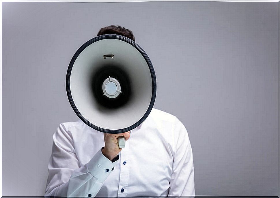 Father speaking through a megaphone representing parenting with a megaphone, that is, educating by shouting.