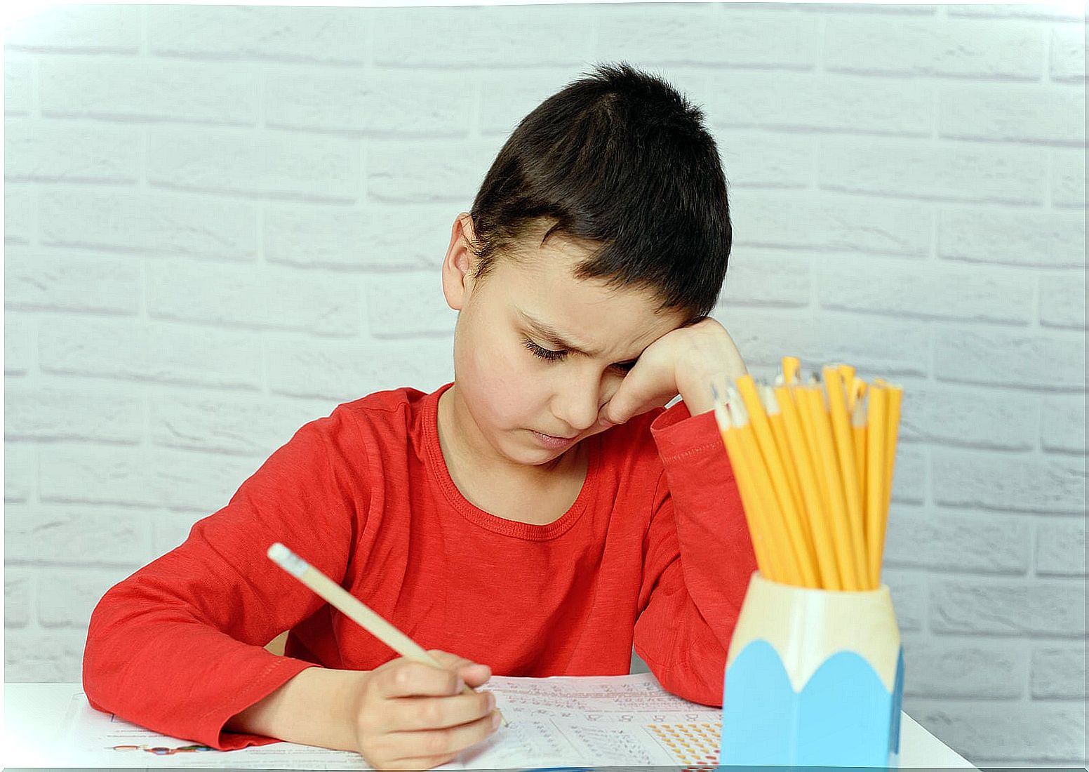 Boy trying to study.