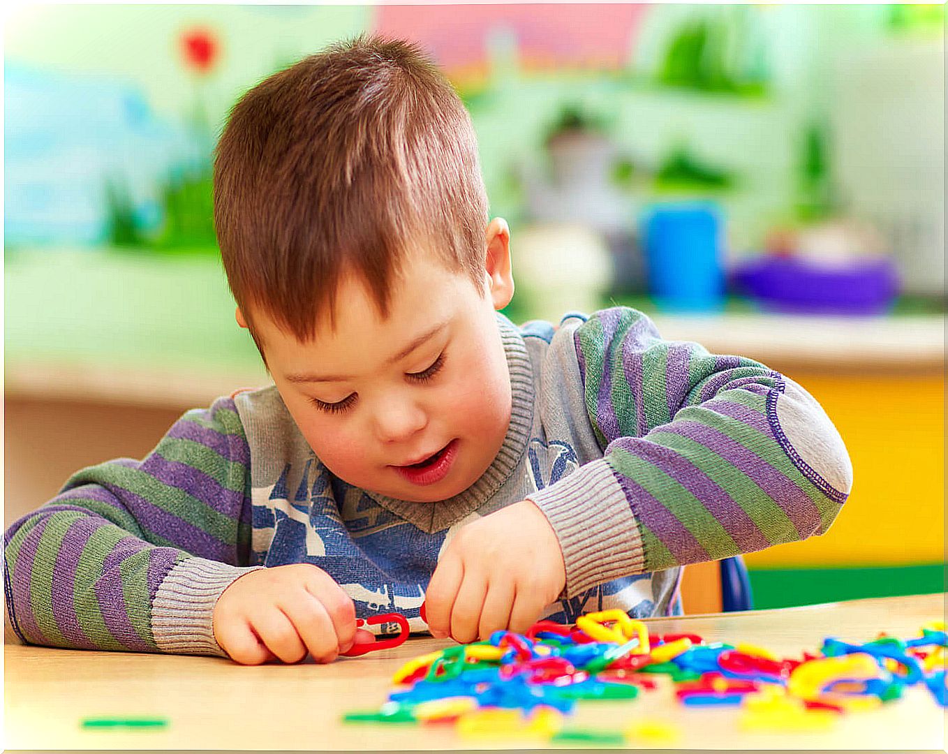 Boy with Pitt-Hopkins syndrome playing.